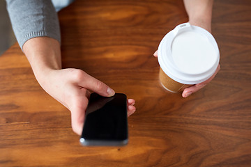 Image showing close up of woman with smartphone and coffee