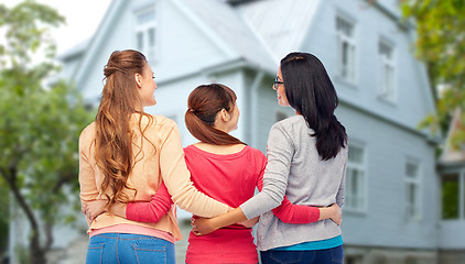 Image showing international happy women from back hugging