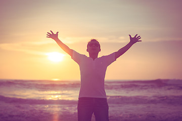 Image showing happy man standing on the beach