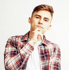 Image showing young handsome teenage hipster guy posing emotional, happy smiling against white background isolated, lifestyle people concept 