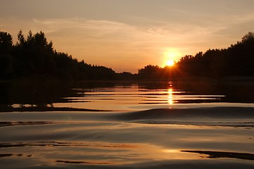 Image showing Sunset over a river