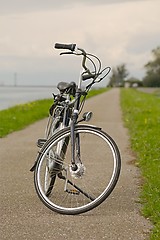 Image showing Bicycle on the road along the river