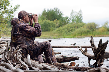 Image showing man with binoculars on the hunt