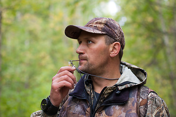 Image showing hunter with a grouse call