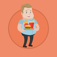 Image showing Man holding tray full of fast food.