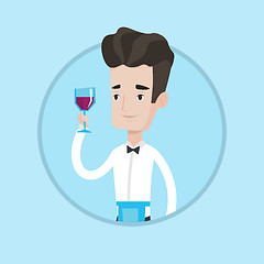 Image showing Bartender holding a glass of wine in hand.