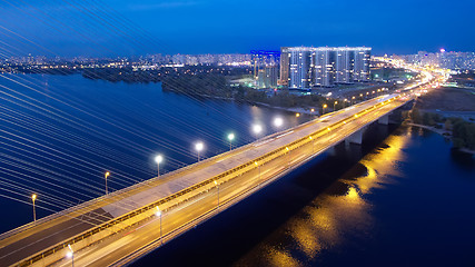 Image showing Automobile and railroad bridge in Kiev, the capital of Ukraine. Bridge at sunset across the Dnieper River. Kiev bridge against the backdrop of a beautiful sunset in Kiev. Bridge in evening sunshine