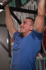 Image showing man doing pull ups