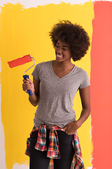 Image showing black woman painting wall