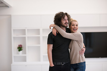 Image showing couple hugging in their new home