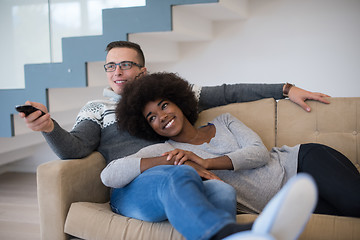 Image showing multiethnic couple relaxing at home