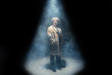 Image showing The senior man as detective or boss of mafia on gray studio background