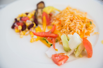 Image showing vegetable salad and garnish on plate