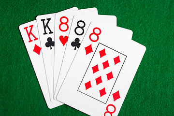 Image showing poker hand of playing cards on green casino cloth