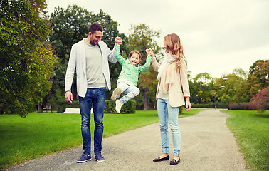 Image showing happy family walking in summer park and having fun