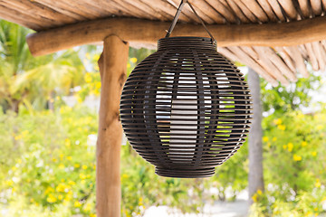 Image showing lantern hanging under shed roof