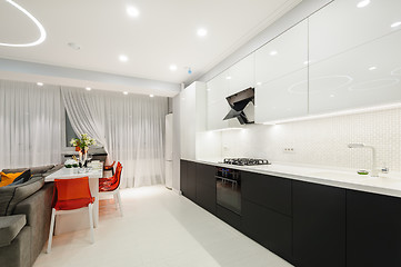 Image showing Modern white kitchen and dining room