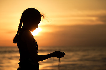 Image showing Portrait of sad teenager girl standing on the beach