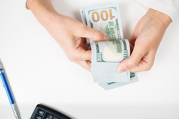 Image showing Female hands counting money,