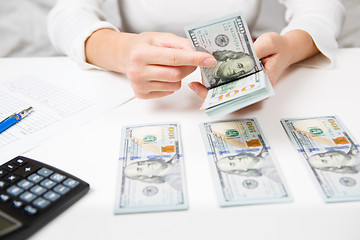 Image showing Hands counting money, close up