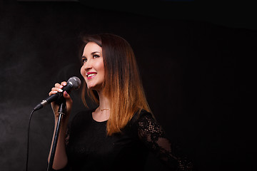 Image showing Singer with microphone in studio