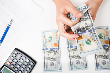 Image showing Hands counting money, close up