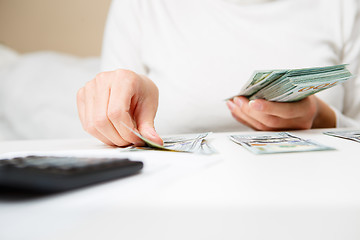 Image showing Hands counting money, close up