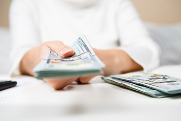 Image showing Hands of person proposing money to you - closeup shot