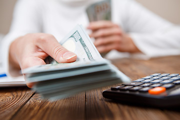 Image showing Hands of person proposing money to you - closeup shot