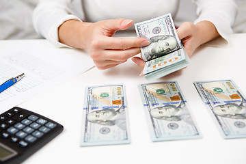 Image showing Hands counting money, close up