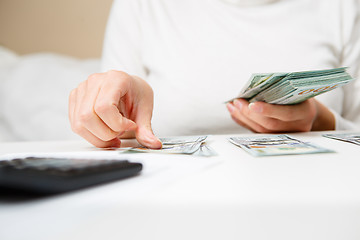 Image showing Hands counting money, close up