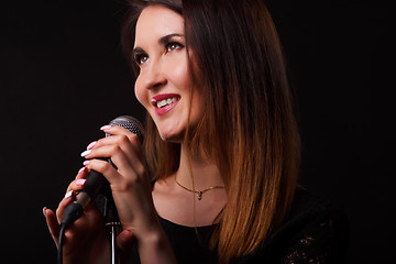 Image showing Portrait of singer with microphone