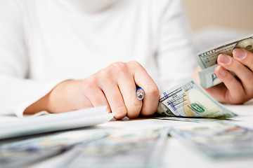 Image showing Hands counting money, close up