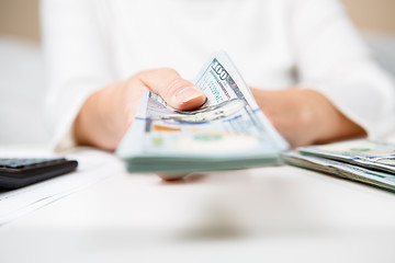 Image showing Hands of person proposing money to you - closeup shot