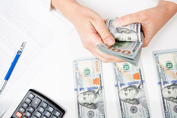 Image showing Hands counting money, close up