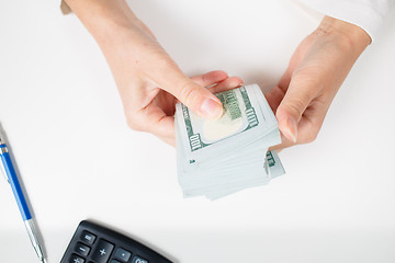 Image showing Female hands counting money,