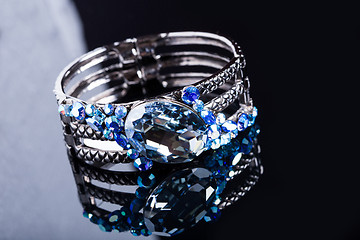 Image showing Bracelet with blue stones over black