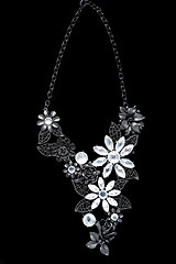 Image showing necklace on a black background. gems. 