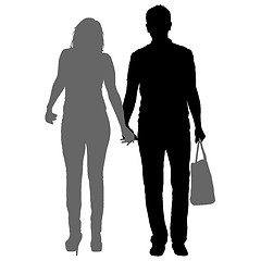 Image showing Silhouette man and woman walking hand in hand