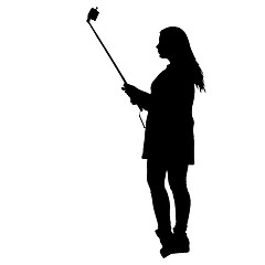 Image showing Silhouettes woman taking selfie with smartphone on white background