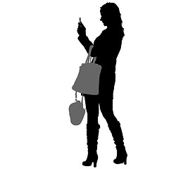 Image showing Silhouettes woman taking selfie with smartphone on white background