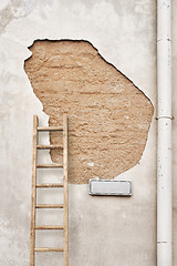 Image showing cracked wall with street sign