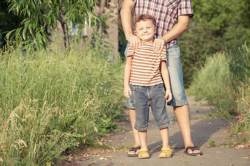 Image showing Father and son playing at the park at the day time.