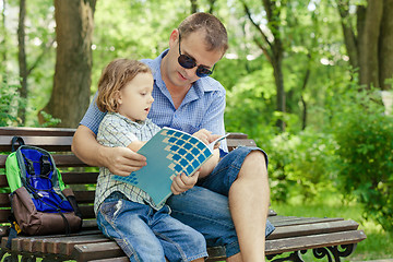 Image showing Father and son playing at the park at the day time.