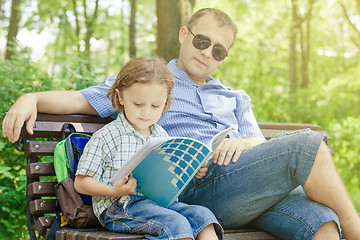 Image showing Father and son playing at the park at the day time.