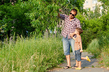 Image showing Father and son playing at the park at the day time.