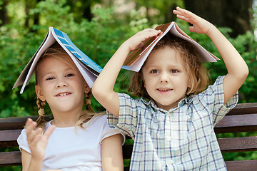 Image showing Three happy children  playing in park