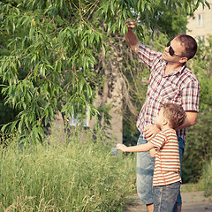Image showing Father and son playing at the park at the day time.