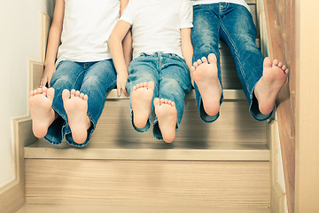 Image showing Portrait of happy children which are sitting on the stairs in th