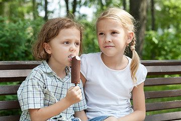 Image showing Two happy children  playing in the park at the day time.